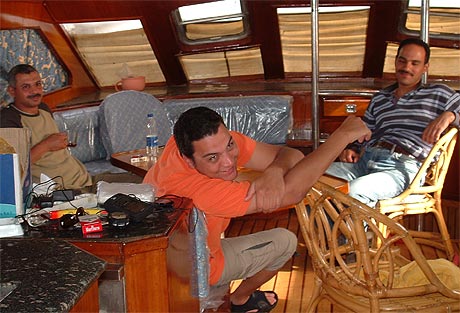 Ayman, Ragy, and Hazim having a fishing break while boat is trolling - Hurghada